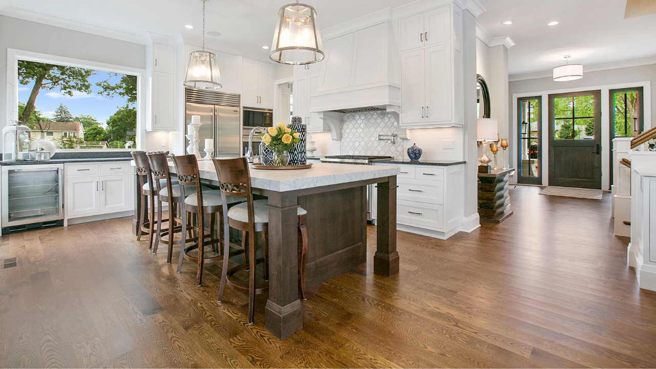 Hardwood flooring in a kitchen with island and breakfast nook