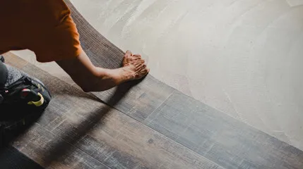 Click-lock laminate plank being installed by Artist Flooring crew