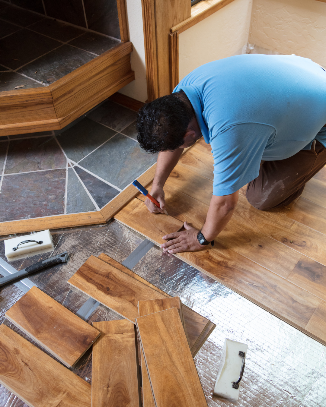 Artist Flooring crew taking precise floor measurements